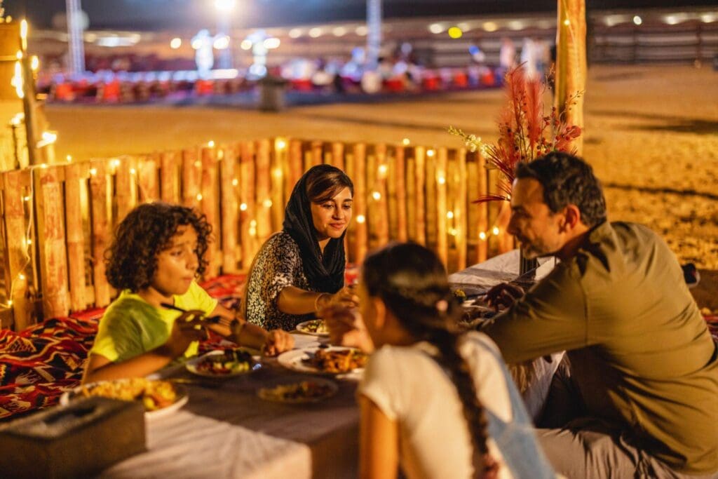 Family enjoying at Lahbab Red Dunes desert safari Dubai